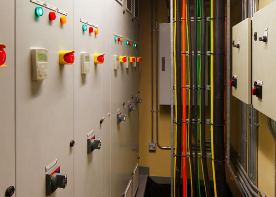 Close up view of electrical wires and control panels at a diagnostic testing facility