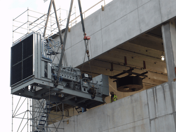 View of equipment being lowered during an Industrial project installation